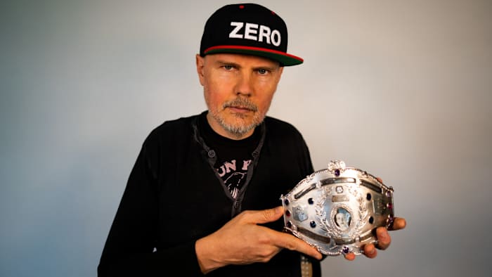 Billy Corgan holding Mildred Burke's title belt